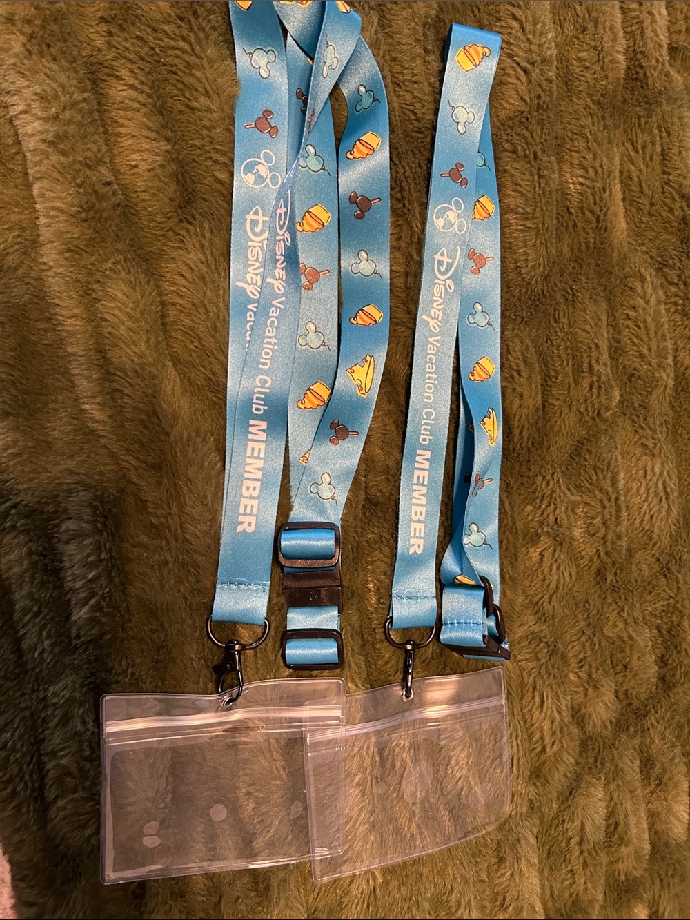 Disney blue lanyards with clear ID holders and Disney icons